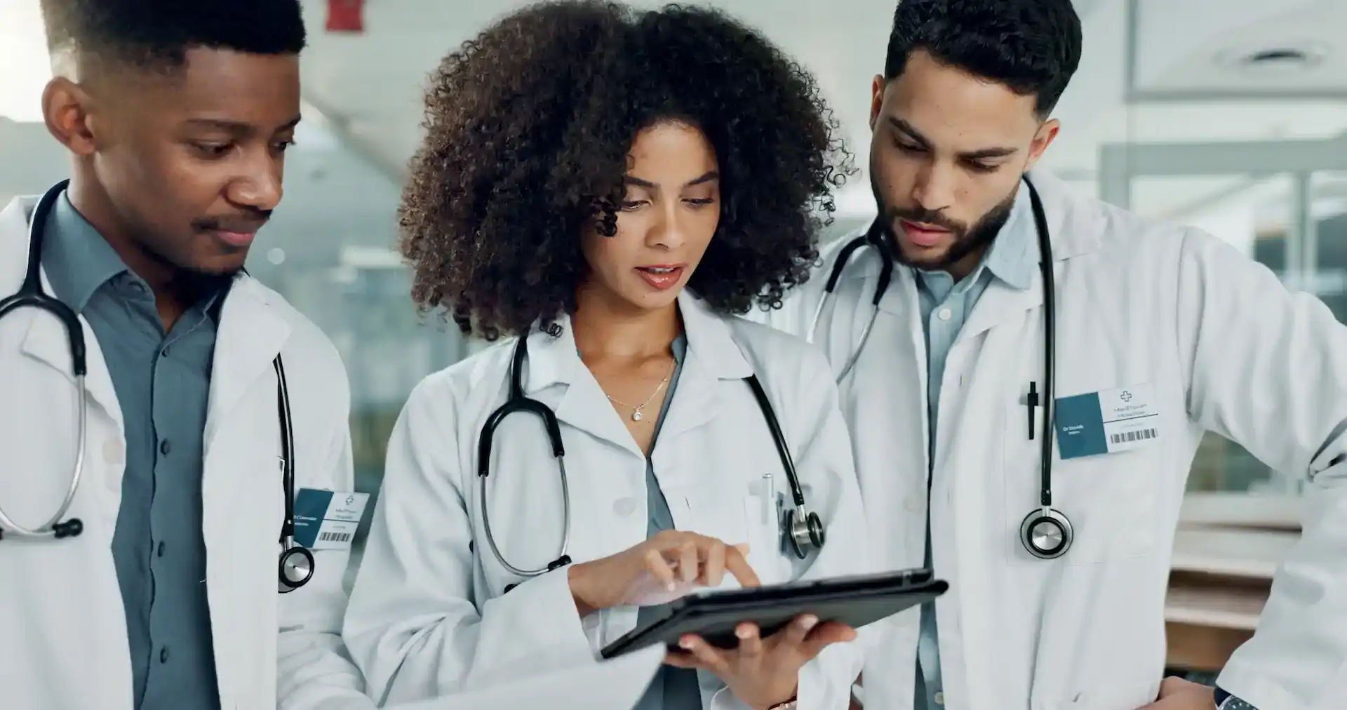 black doctors viewing medical records on a tablet