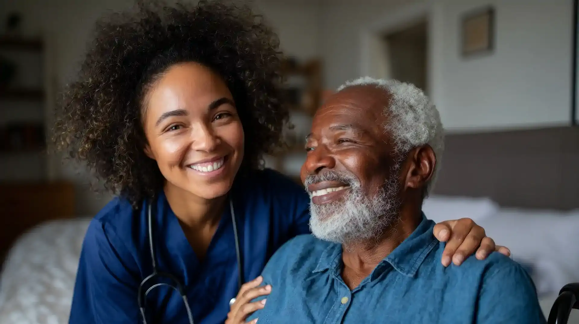 female doctor and elderly african-american male patient smiling